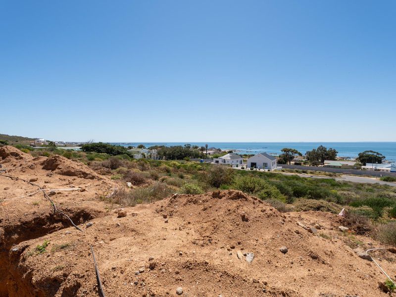 Elevated view overlooking the coastal landscape and ocean from the vacant residential plot.