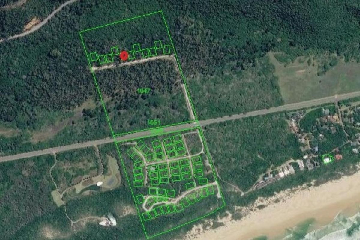 Aerial view of the residential land parcel showing site boundaries, surrounding vegetation, and proximity to the coastline and local road network.