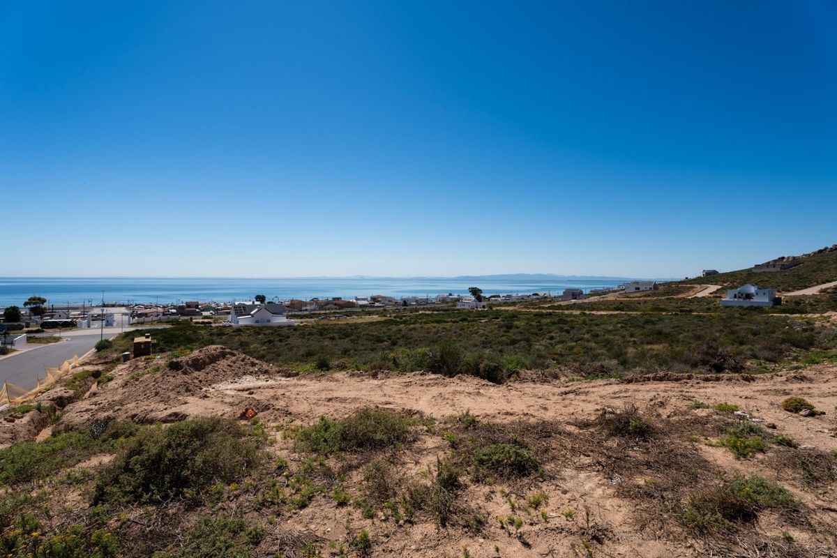 Elevated view overlooking the coastal landscape and ocean from the vacant residential land.
