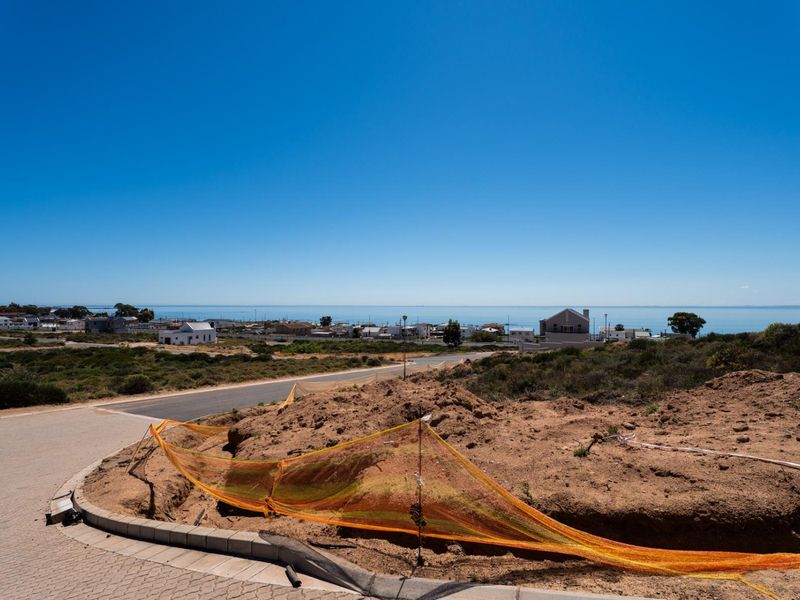 A view of the surrounding residential area and coastline from the vacant residential plot.