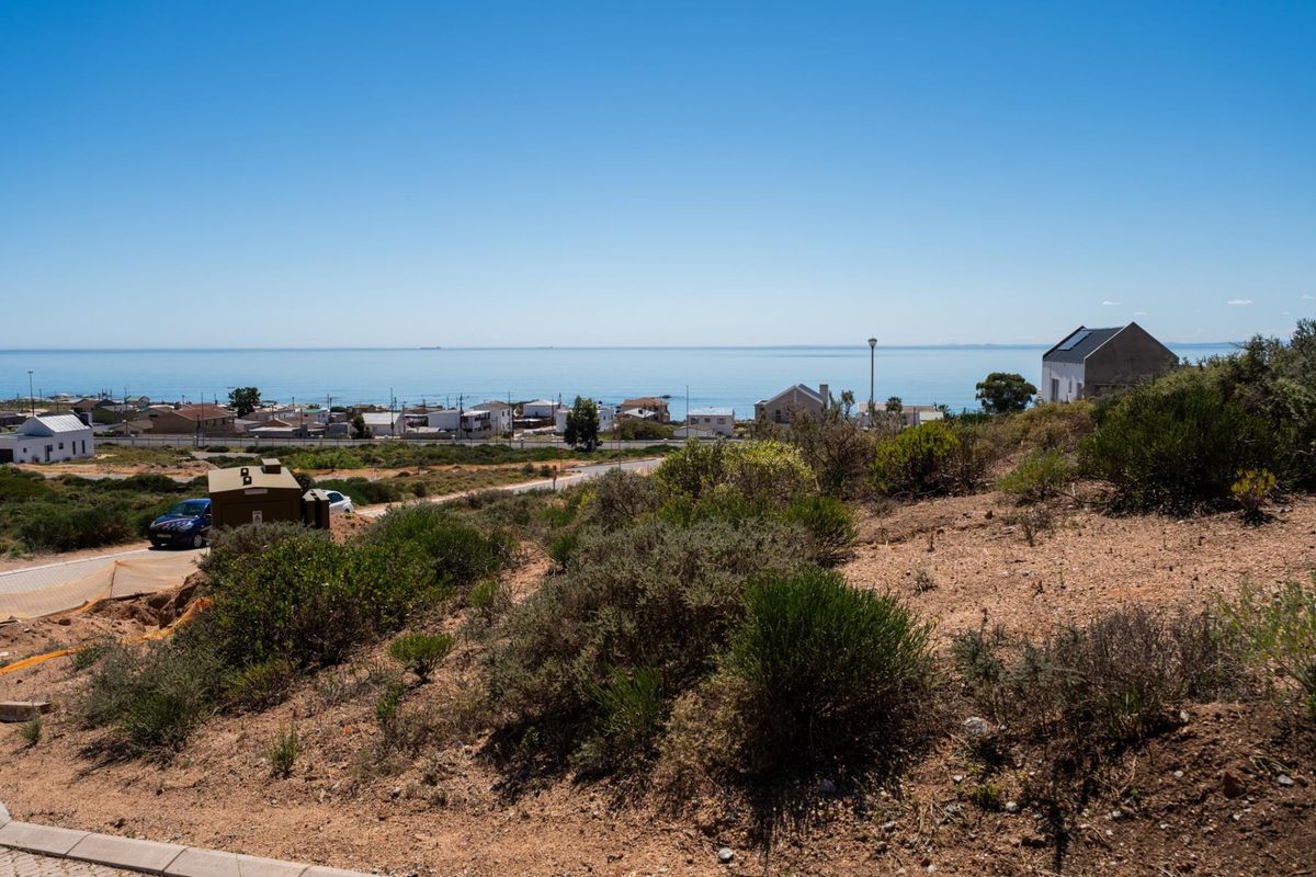 A scenic view overlooking the coastal landscape and ocean from the vacant residential land.