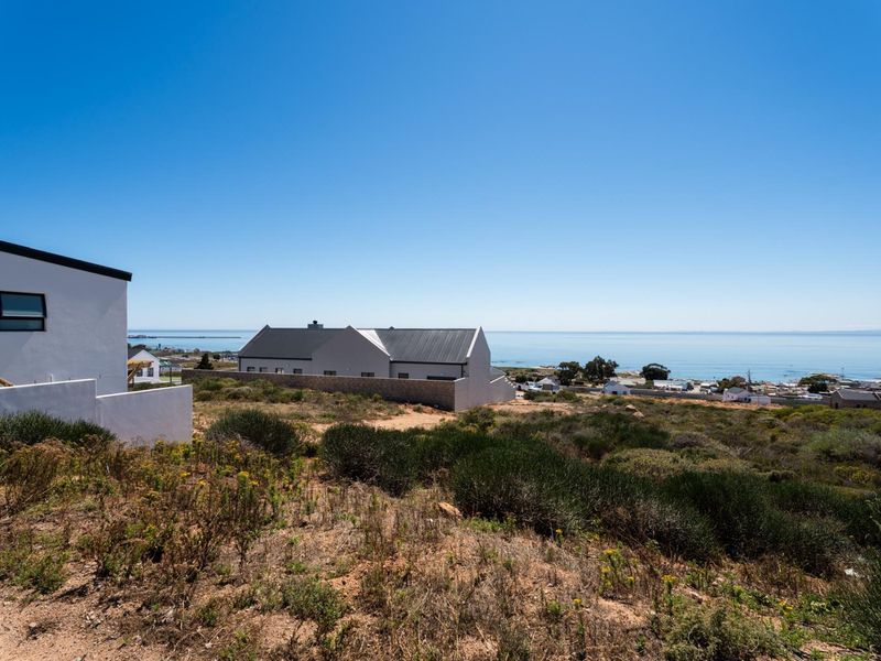 A scenic view overlooking the coastal landscape and ocean from the residential property.