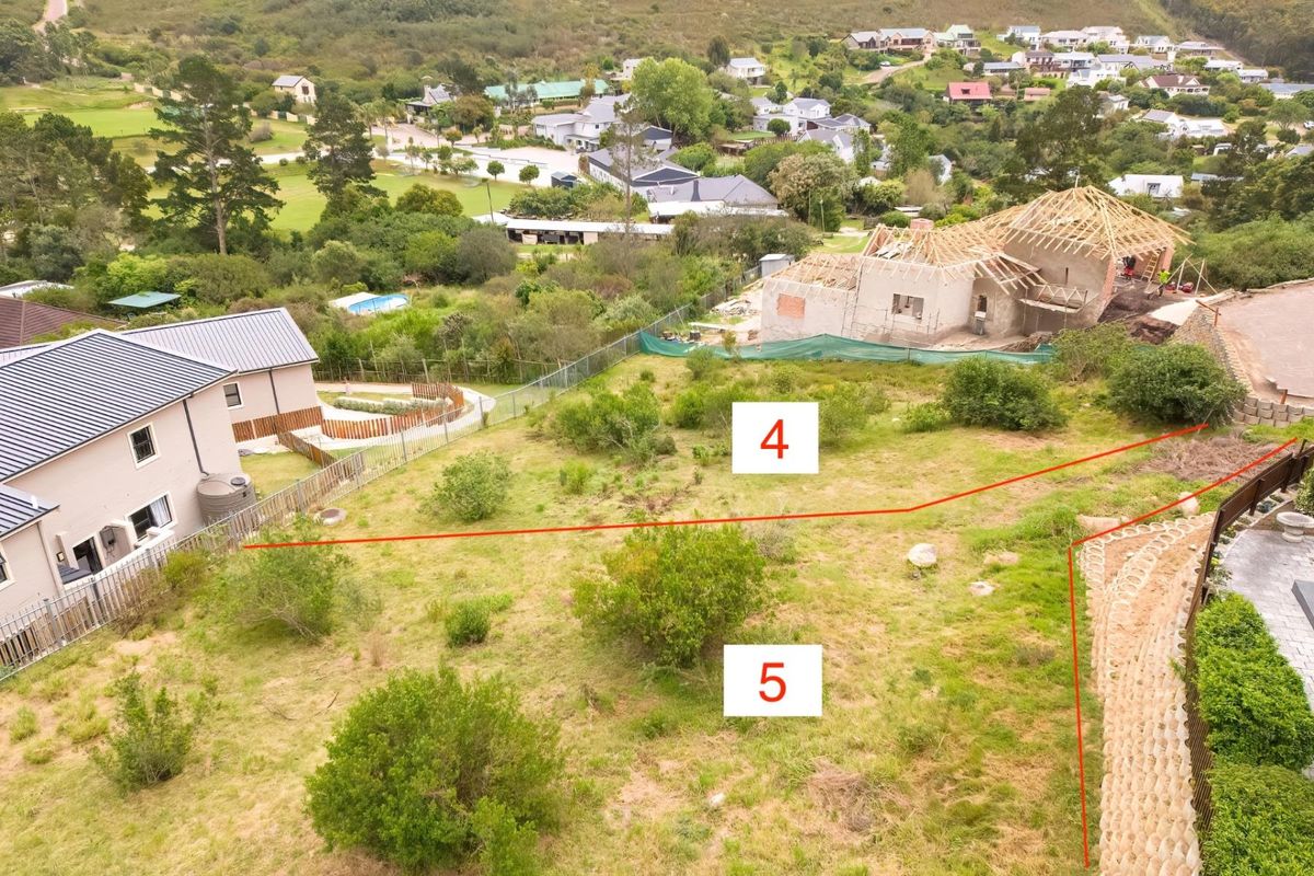 Aerial view of vacant residential land plots marked 4 and 5, featuring natural vegetation, perimeter fencing, and a nearby retaining wall.