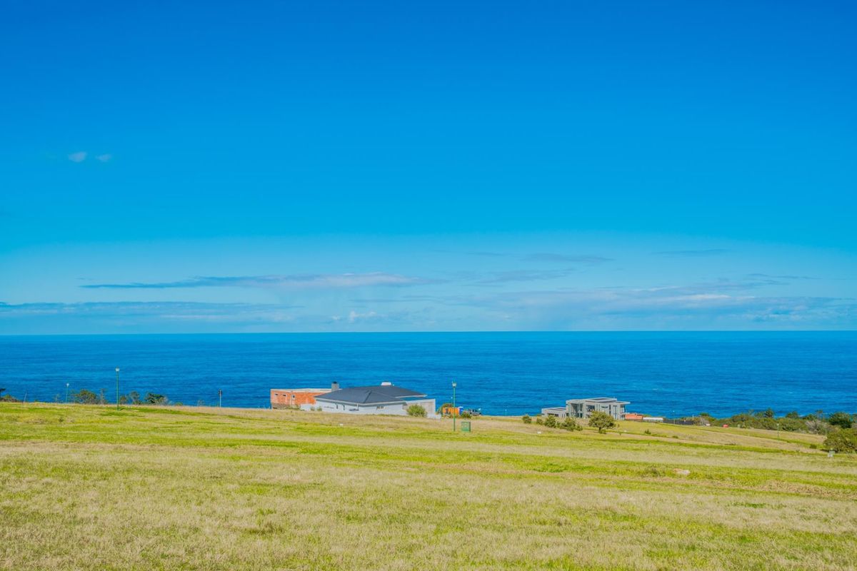 A scenic view of the ocean and coastal landscape from the vacant residential land.