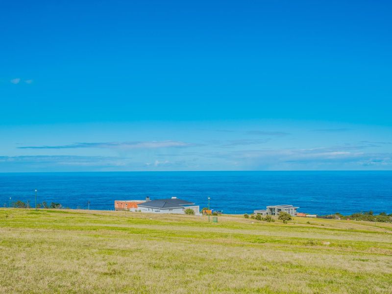 A scenic view of the ocean and coastal landscape from the vacant residential land.