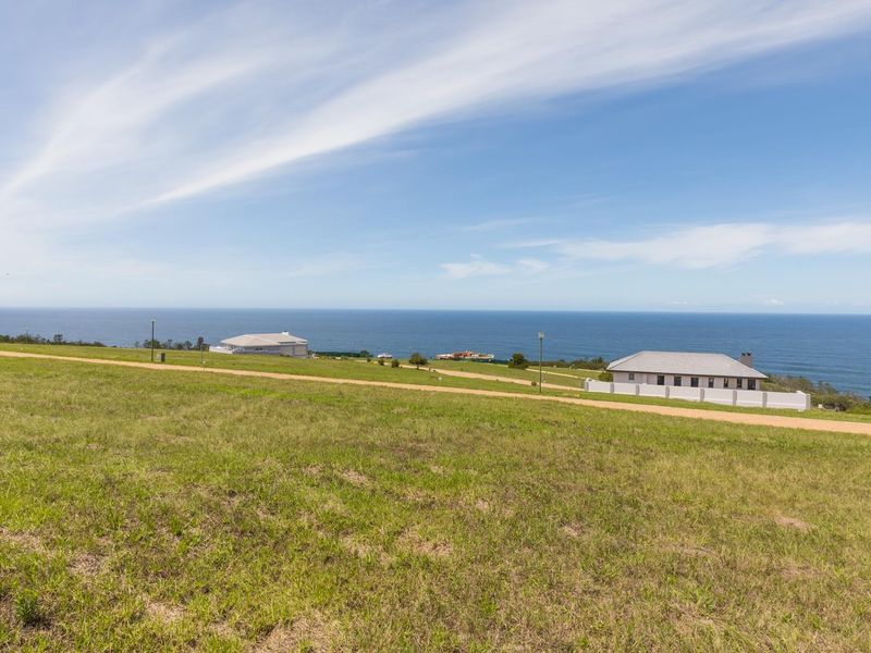 A scenic view of the ocean and coastal landscape from the vacant residential land.