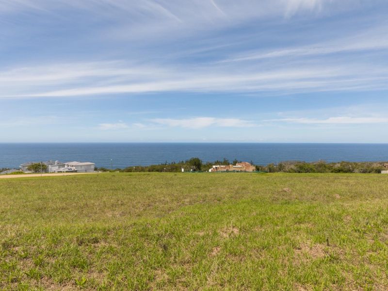 A scenic view of the ocean from the vacant residential land, showcasing the coastal landscape and horizon.