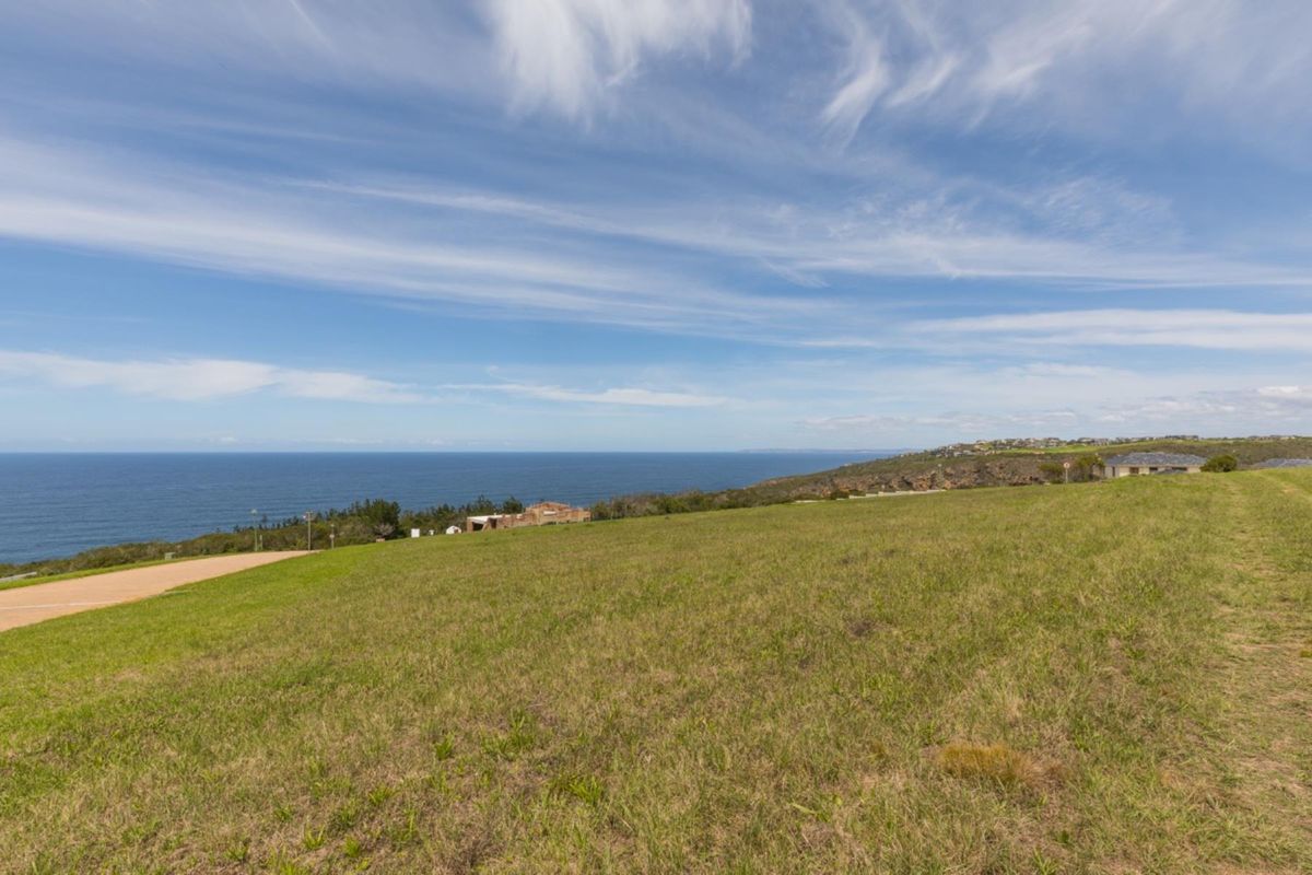 A scenic view of the coastline and ocean from the vacant residential land, showcasing the natural landscape and horizon.