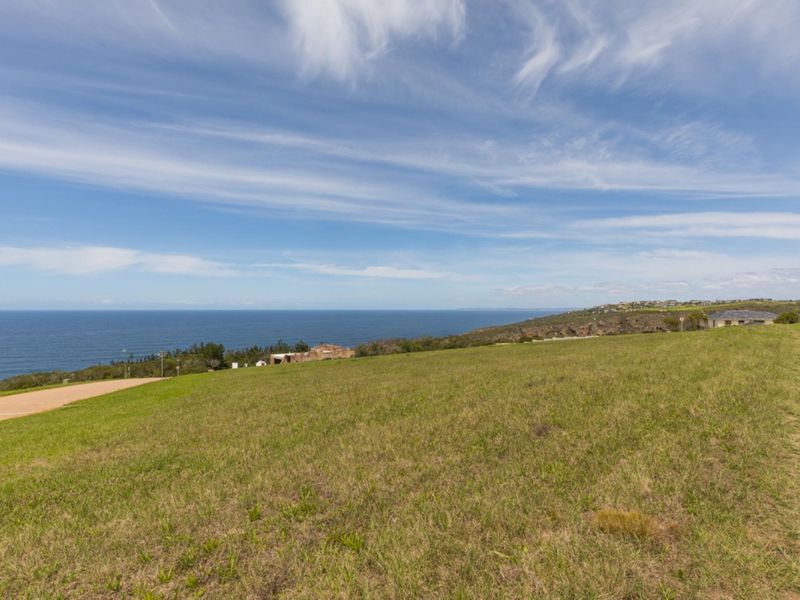 A scenic view of the coastline and ocean from the vacant residential land, showcasing the natural landscape and horizon.