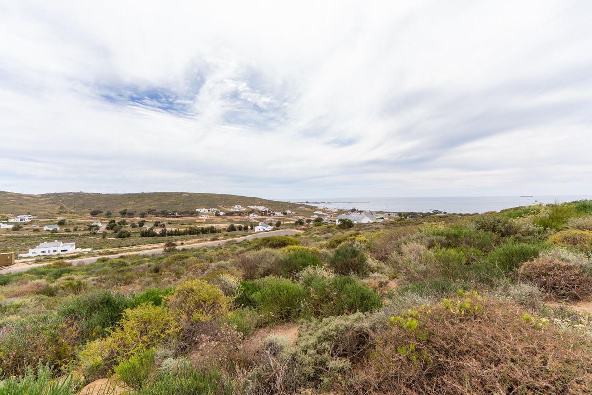 A scenic elevated view overlooking the coastal landscape, surrounding residential area, and distant ocean horizon.