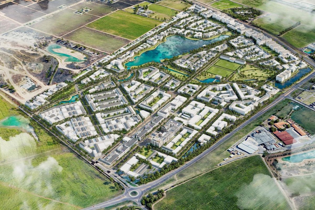 An aerial 3D render showcasing the master plan of a large-scale residential development, including apartment blocks, green spaces, and a central lake.
