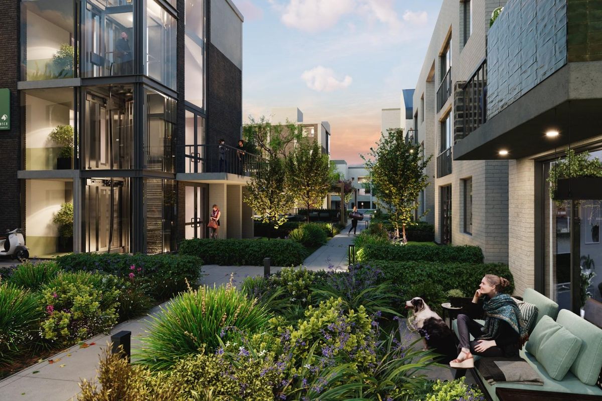 A modern apartment complex courtyard featuring landscaped gardens, paved walkways, and contemporary building facades with glass balconies.