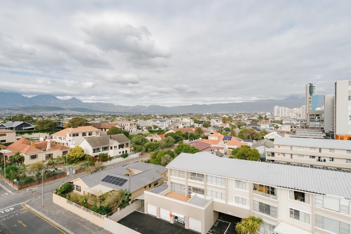 Elevated aerial view overlooking the surrounding residential neighborhood, featuring mountain vistas and urban landscape.