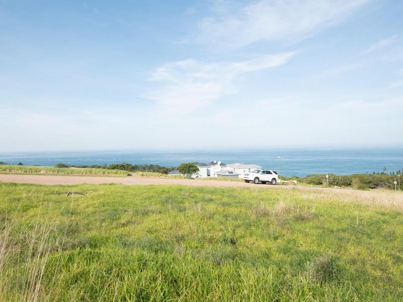 A scenic view of the ocean and coastal landscape from the vacant residential land.