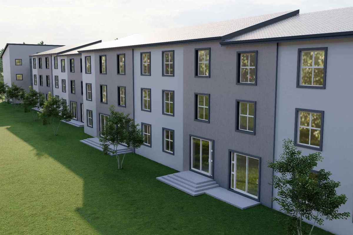 A digital rendering of a multi-story retirement village building featuring a modern grey facade, uniform window placement, and ground-level patio access.
