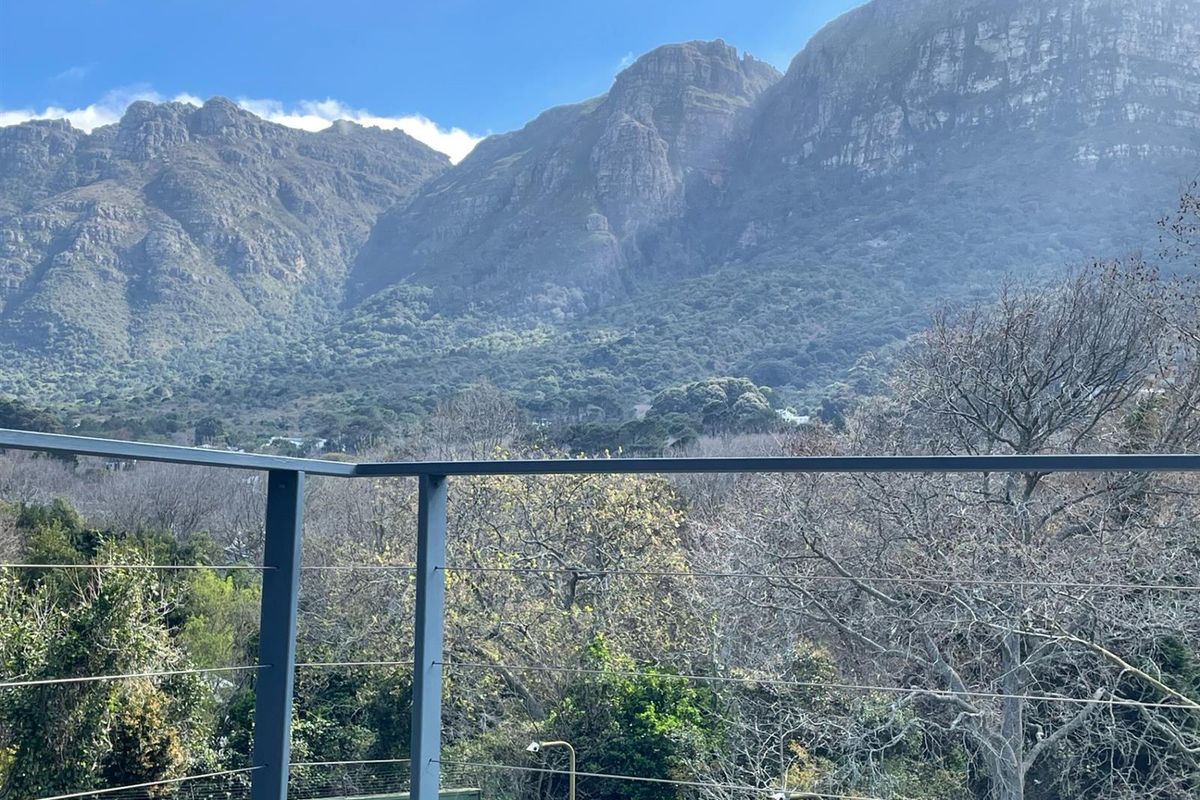 Privately positioned at the end of cul de sac this double volume home has sweeping mountain views - Photo 4