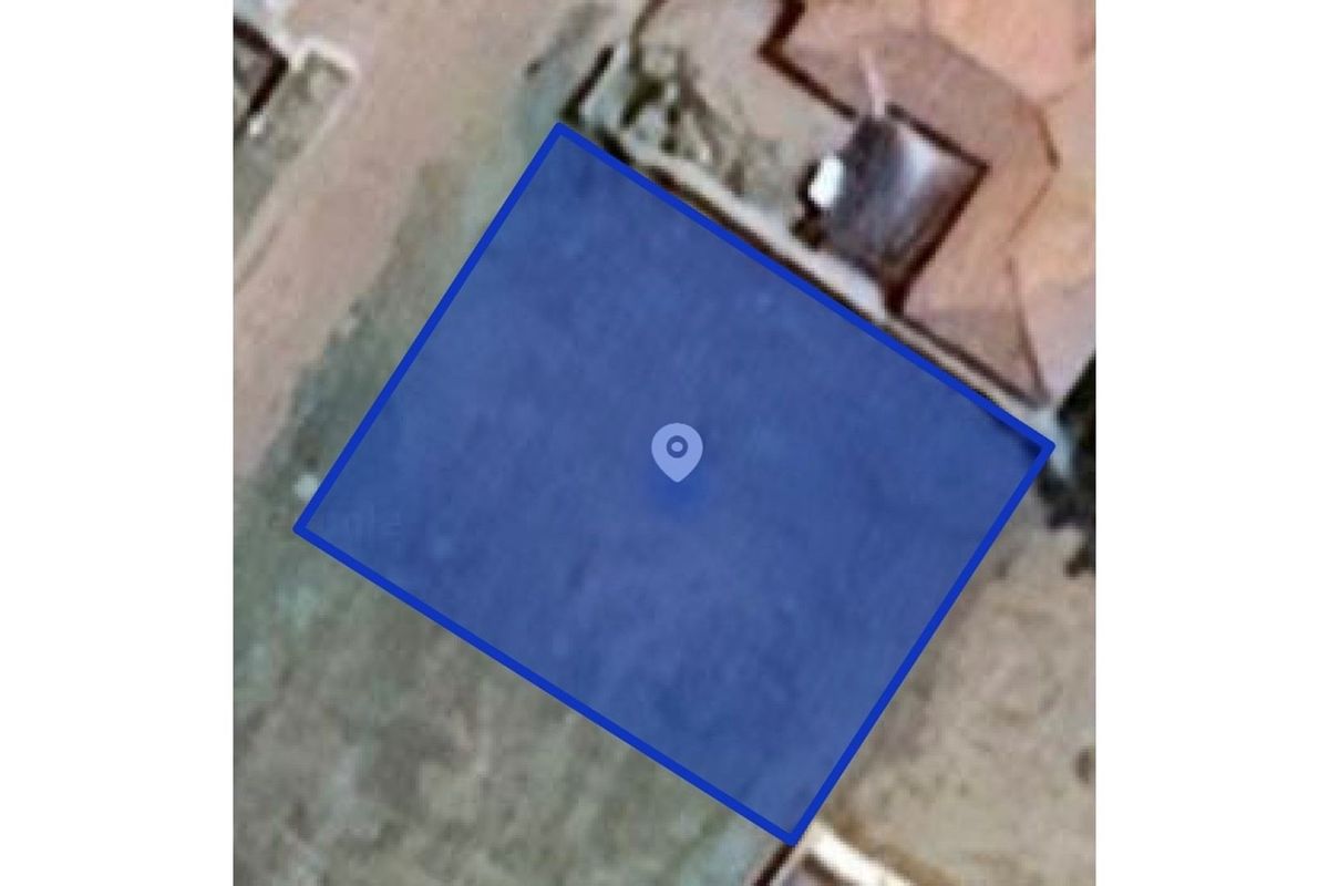 An aerial satellite view showing the boundaries of the vacant residential land plot.