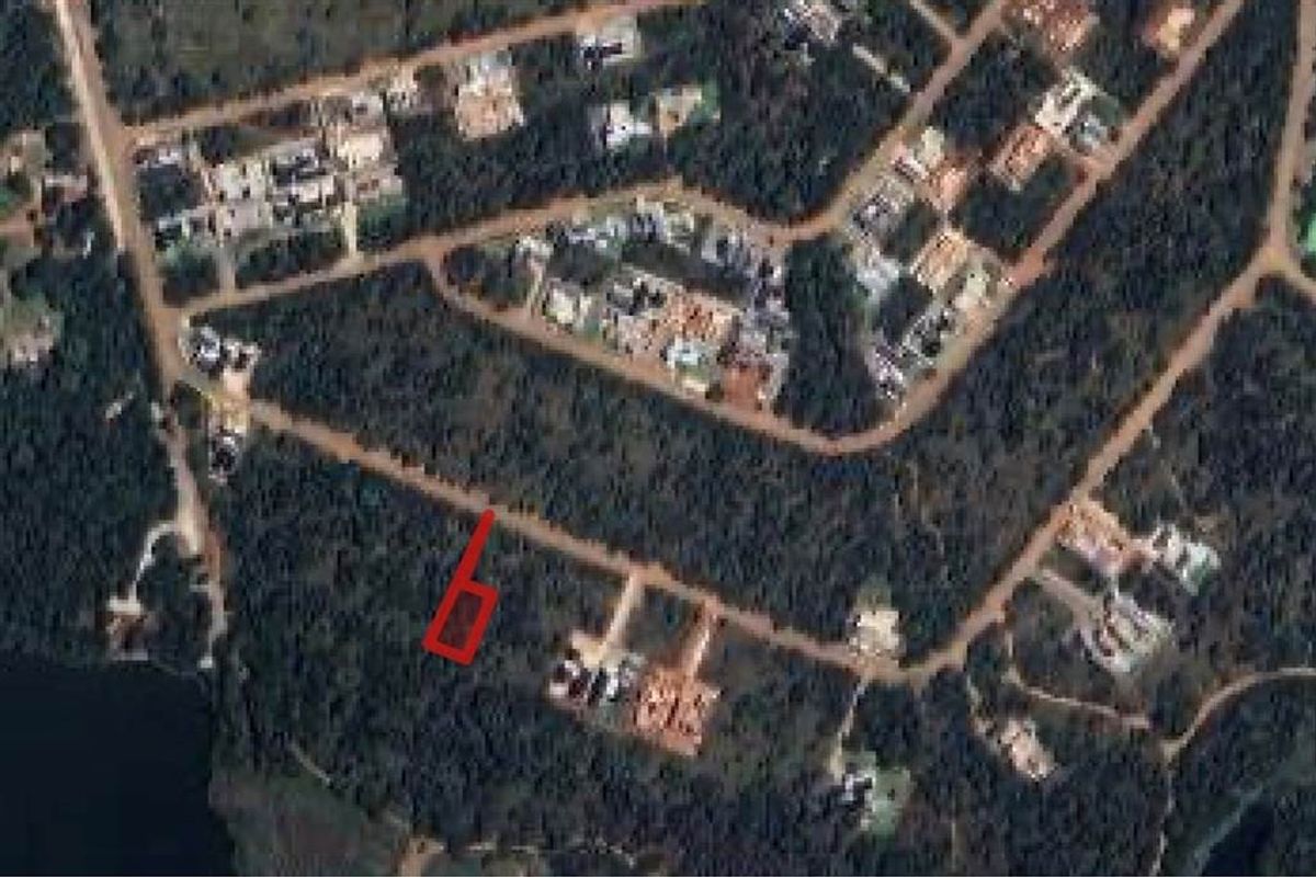 Aerial satellite view showing the location of the vacant residential land plot within the surrounding neighborhood.