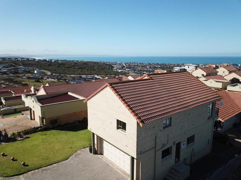 Elegant Facebrick Home with Breathtaking Mountain and Ocean Views In A Security Complex - Photo 4