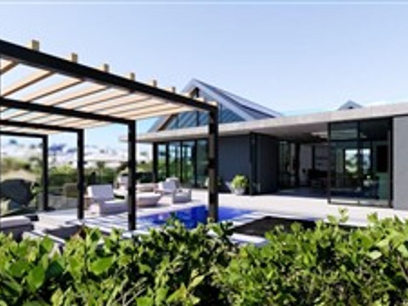 Modern outdoor living area featuring a swimming pool, a contemporary timber pergola, and seamless indoor-outdoor flow through large sliding glass doors.