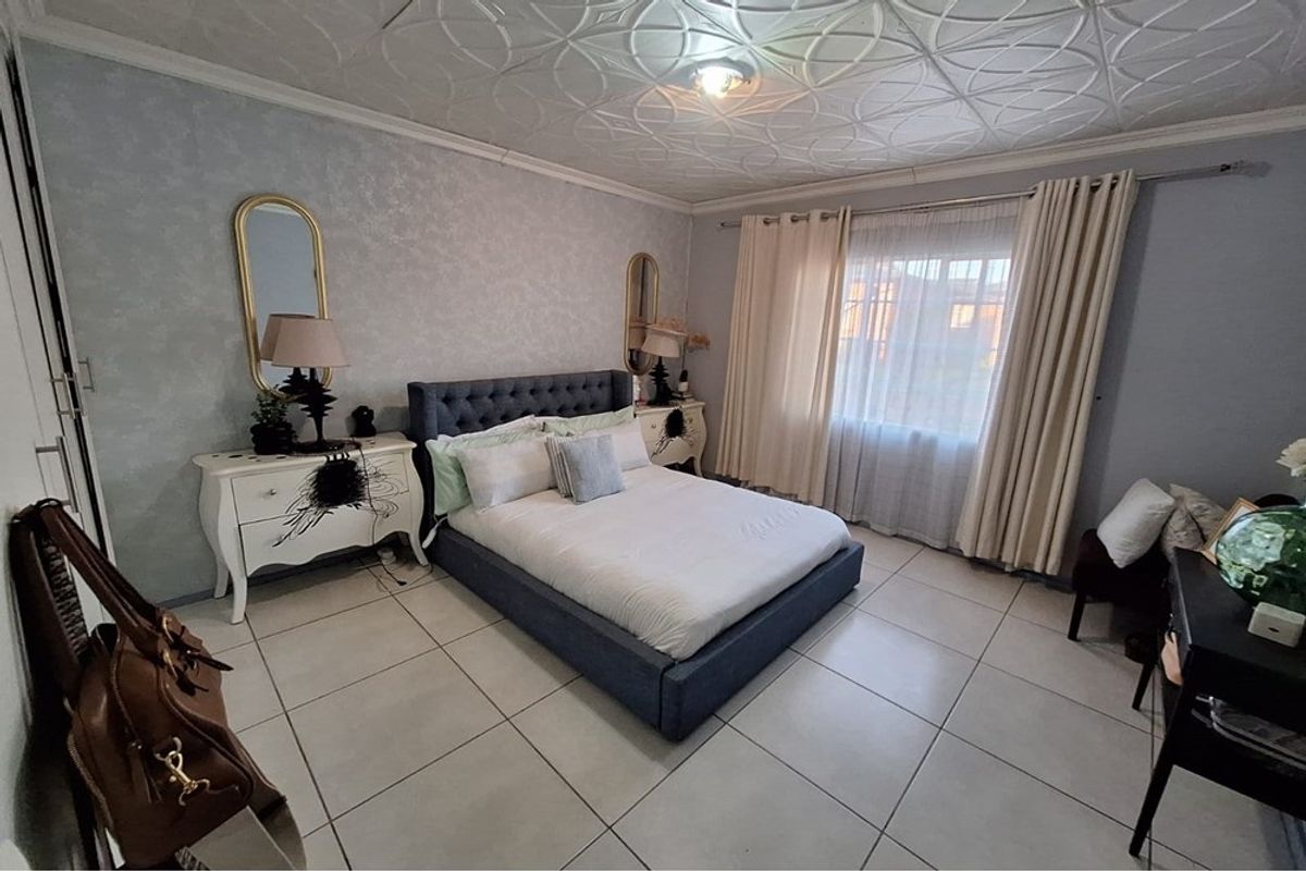 Secure, Stylish Gem with Perks Awaiting New Family - Photo 2