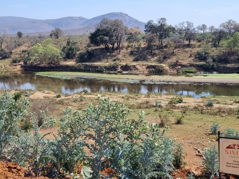 Scenic view of the river frontage and natural landscape at Simbini Lifestyle Estate, showcasing the expansive 2379m² vacant residential stand.
