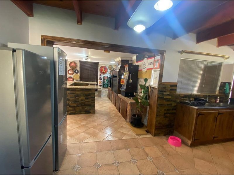 Charming Four-Bedroom Family Home with Entertainment Features - Photo 10