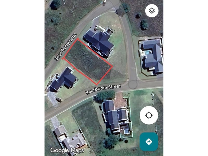 An aerial view of a vacant residential corner plot located at the intersection of Sour Berry Lane and Keurboom Street.