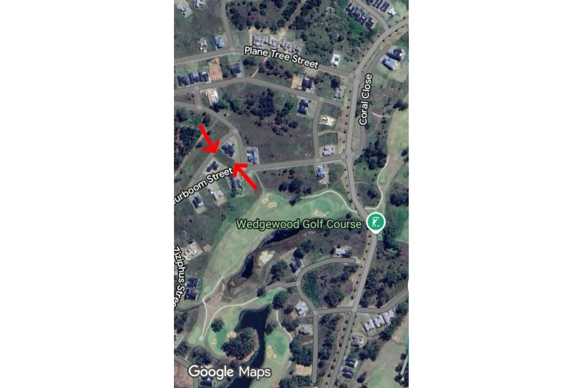 Aerial view of the residential area and surrounding golf course, highlighting the property location within the estate.