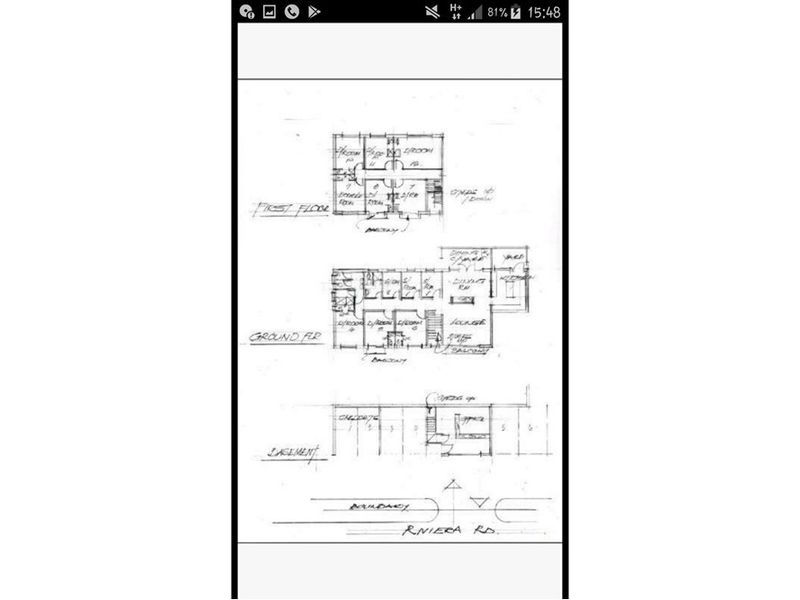 A hand-drawn architectural floor plan showing the layout of the ground floor, first floor, and basement levels of the residential property.