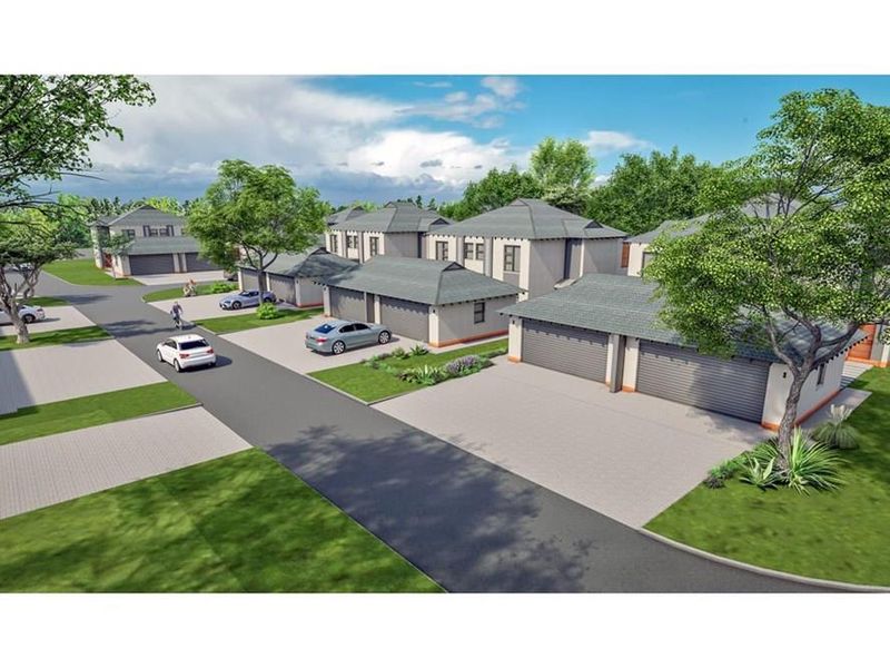 An aerial perspective of a modern townhouse complex featuring paved driveways, tiled roofs, and well-maintained communal garden areas.