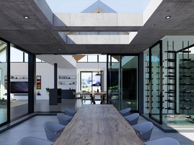 Modern open-plan living area featuring a central skylight, floor-to-ceiling glass walls, and a dedicated glass-enclosed wine display.