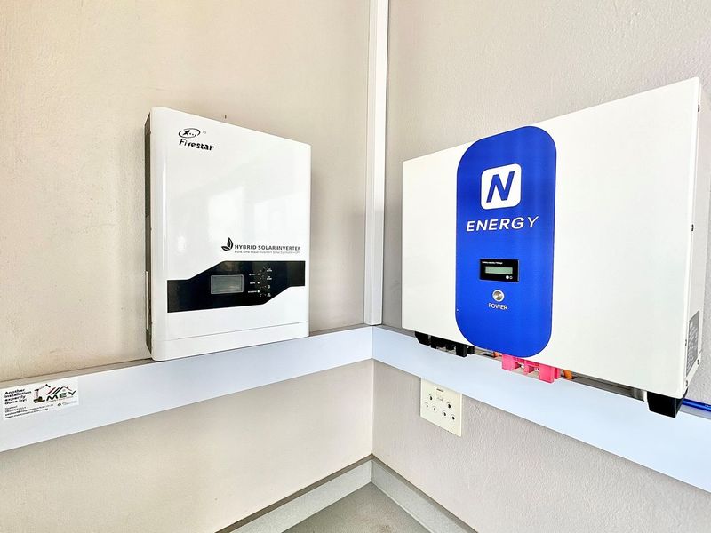 A wall-mounted solar power system featuring a Fivestar hybrid solar inverter and an N-Energy battery unit for efficient energy management.