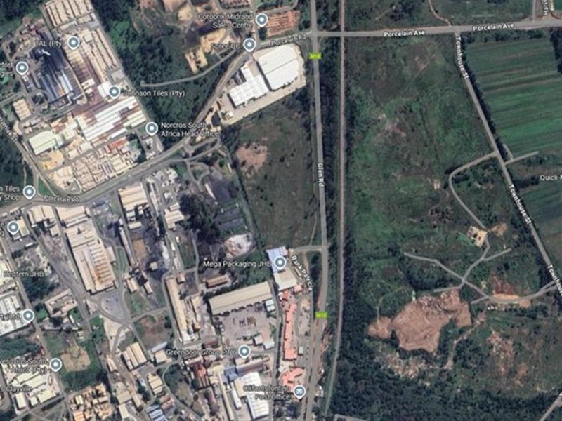 An aerial satellite view showing the surrounding industrial area, road infrastructure, and commercial property locations.