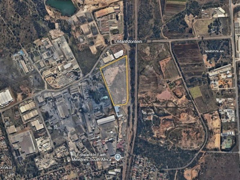 Aerial view of an industrial land parcel situated near major transport routes and existing industrial infrastructure.