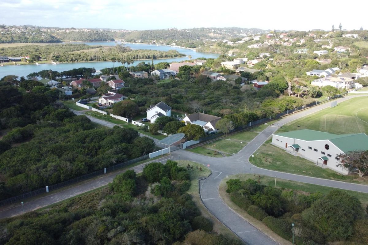 Aerial view of the residential estate, showcasing the surrounding landscape, nearby river, and local infrastructure.