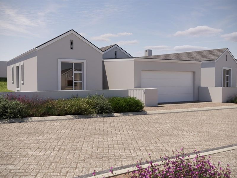 Modern single-story residential house featuring a clean facade, integrated garage, and paved driveway in a well-maintained estate setting.