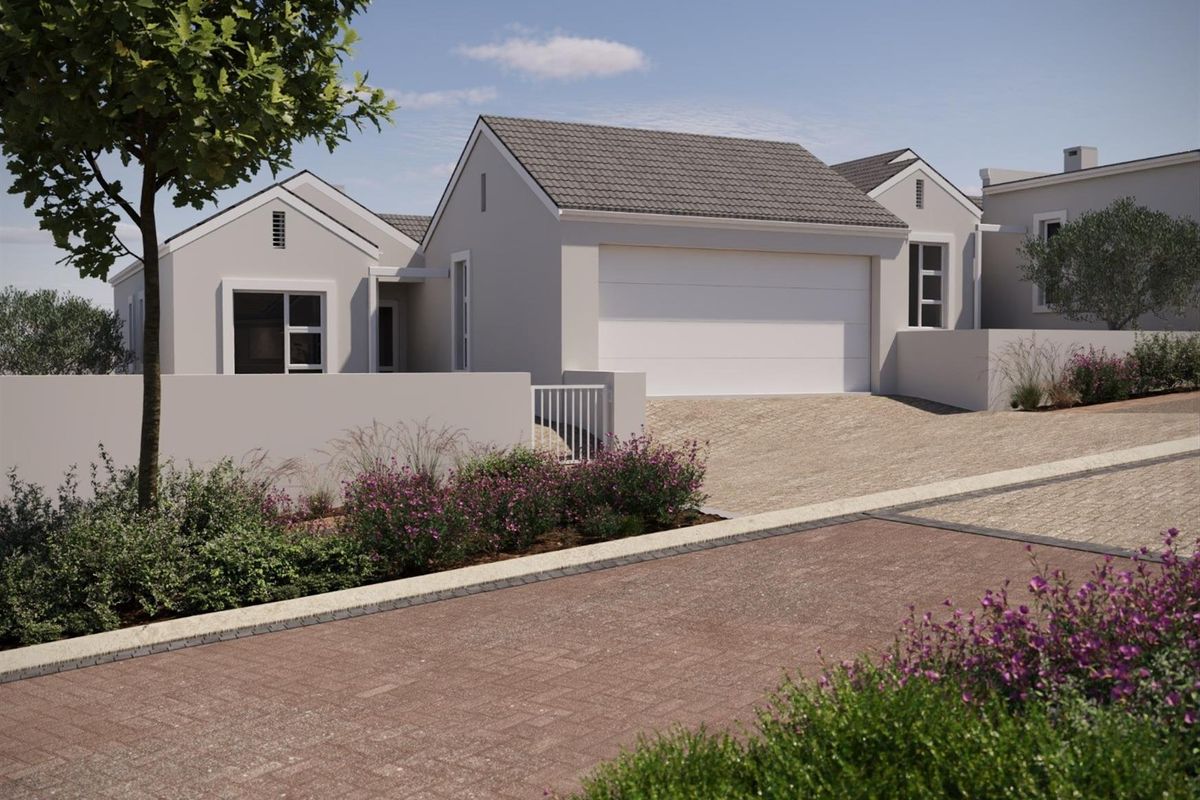A modern residential exterior featuring a tiled roof, a secure garage, and a paved driveway with landscaped garden borders.