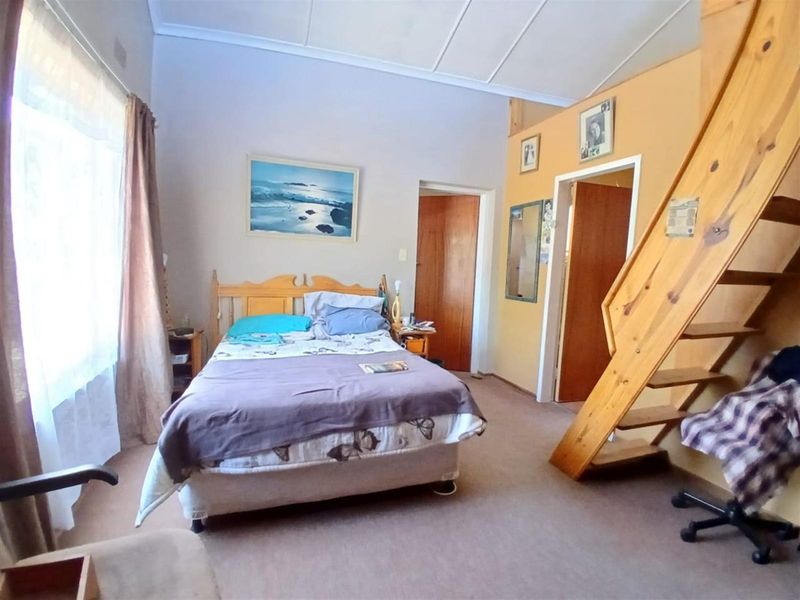 Spacious Family Home with Dual Lofts Expansive Yard - Photo 8