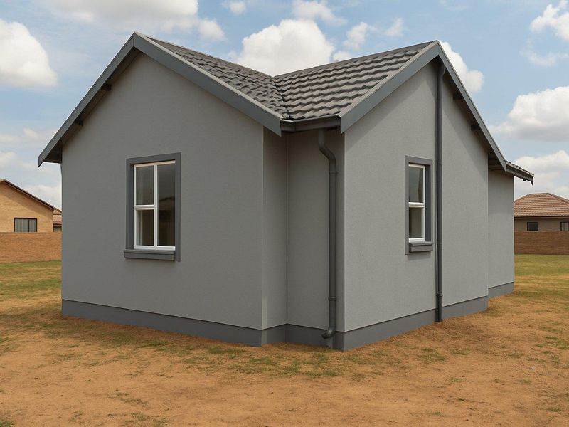 A modern, compact detached house featuring a grey rendered facade, tiled roof, and white-framed windows, set on a clear, open plot.