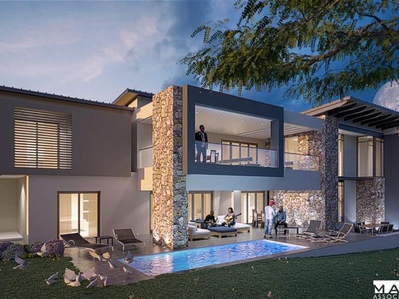 Modern luxury residence featuring a rear patio, swimming pool, stone-clad architectural elements, and expansive glass sliding doors for seamless indoor-outdoor living.