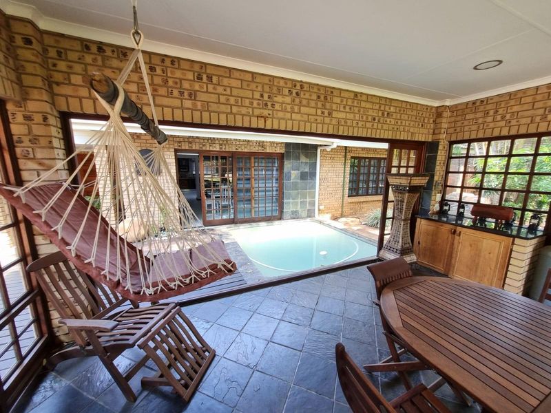 Immaculate Modern Home on Double Stand | Entertainer’s Dream with Pool & Lush Garden - Photo 6