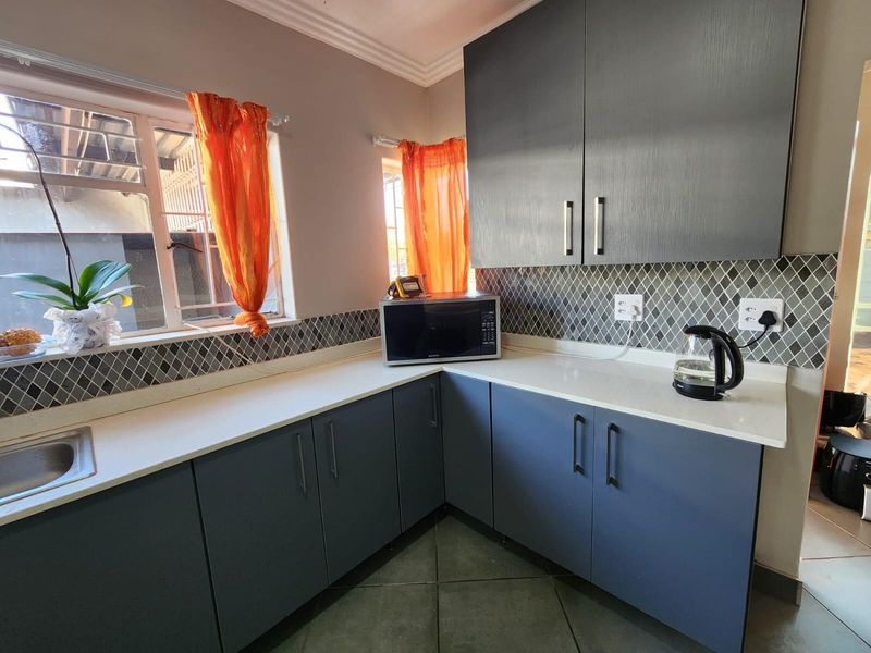 Neat Renovated Freestanding 3 Bedroom Home with 1 Bedroom Flat ,with big yard for sale. - Photo 2