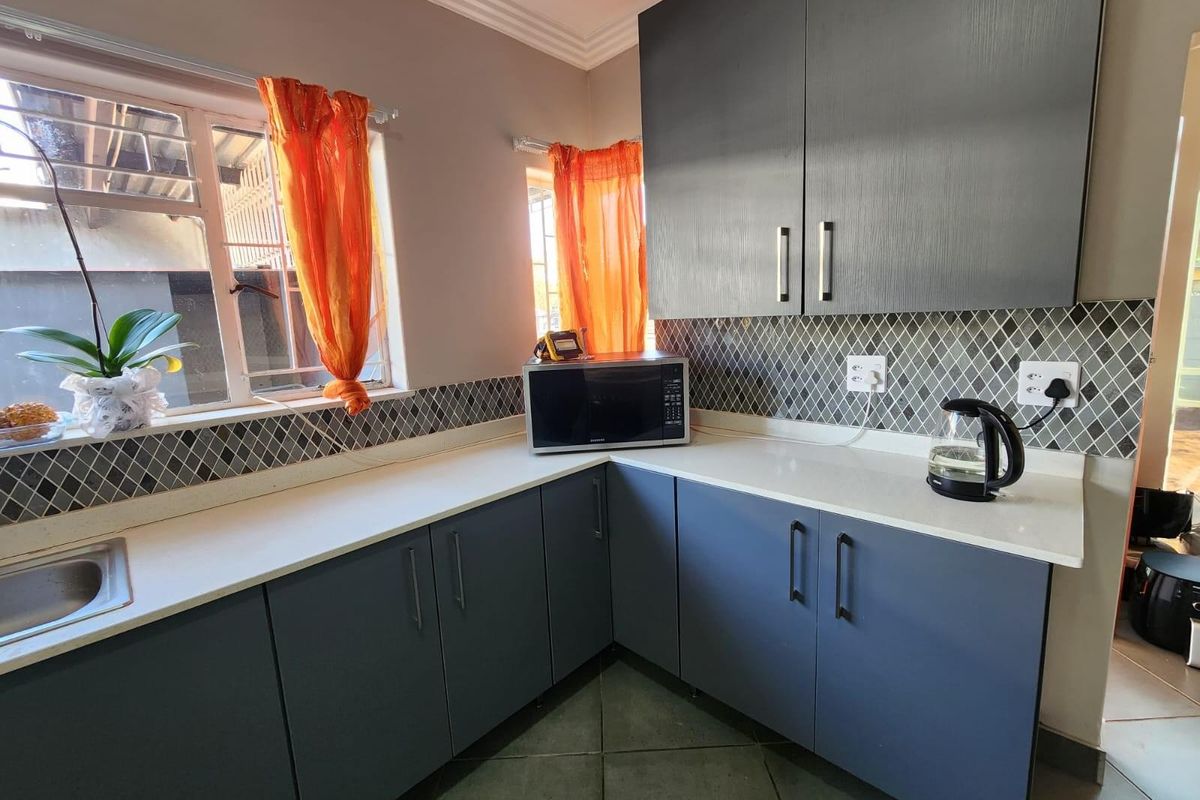 Neat Renovated Freestanding 3 Bedroom Home with 1 Bedroom Flat ,with big yard for sale. - Photo 2