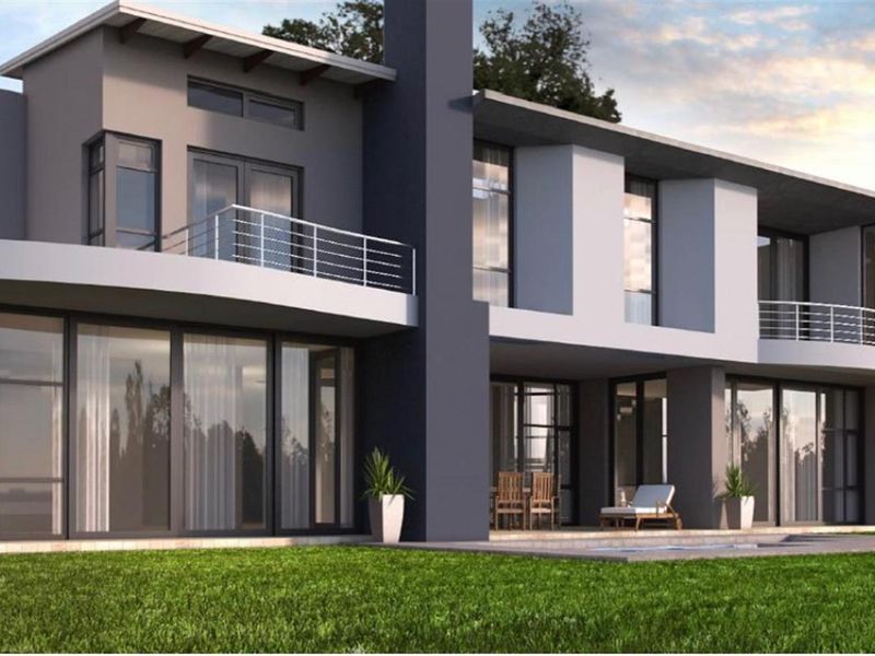 A modern two-story residential property featuring expansive glass sliding doors, a balcony with metal railings, and a well-maintained lawn.