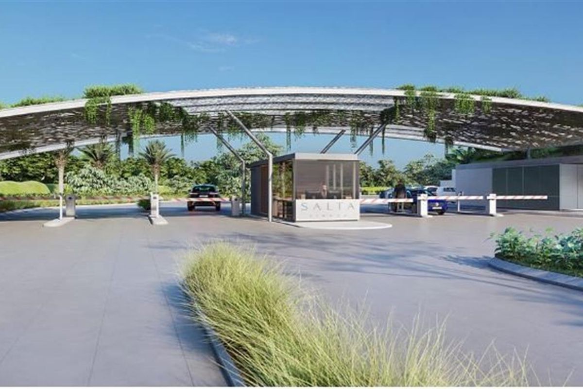 A modern, architecturally designed security entrance gate for the residential estate, featuring a large canopy structure and controlled access point.