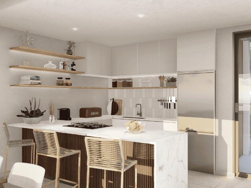 Modern kitchen featuring a marble-look island with integrated gas cooktop, floating timber shelving, and sleek cabinetry, seamlessly connecting to an outdoor balcony area.