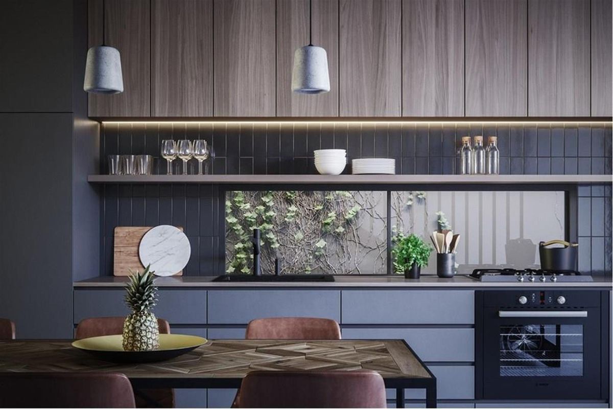 Modern kitchen featuring sleek cabinetry, integrated oven, gas cooktop, and a unique window splashback overlooking a garden wall.