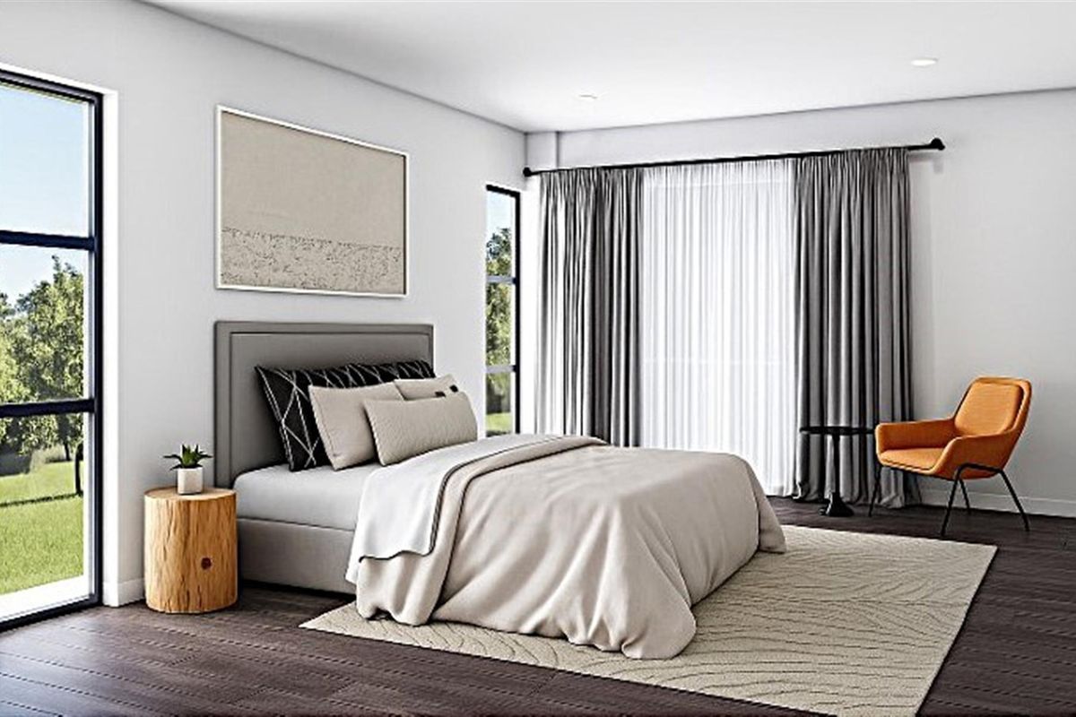 A modern, well-lit bedroom featuring dark timber flooring, large windows with floor-to-ceiling curtains, and a neutral color palette.