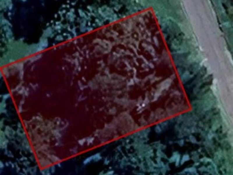 An aerial satellite view showing the boundary of the vacant residential land plot.